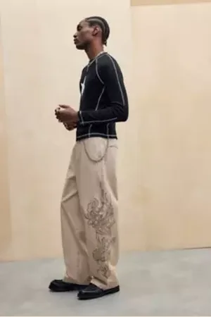 ED HARDY UO Exclusive Sand Dragon Outline Trousers in a Urban Outfitters