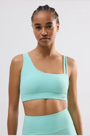 YSABEL MORA Reggiseno sportivo asimmetrico di colore azzurro con sostegno leggero