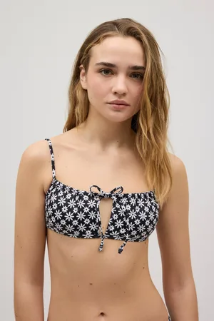 YSABEL MORA Top bikini con dettaglio fiocco di fiori bianchi e neri