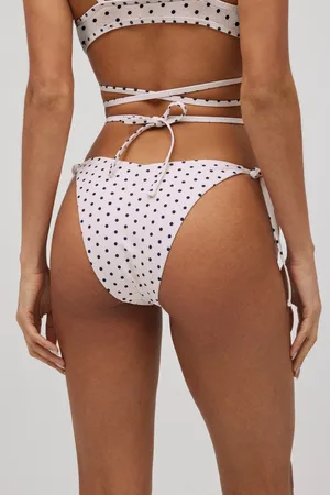 YSABEL MORA Slip bikini brasiliano annodato a pois bianchi